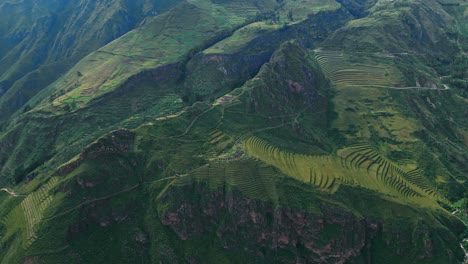 Enjoy-a-panoramic-aerial-view-as-we-explore-the-grandeur-of-Pisac-Sacred-Valley,-highlighting-its-terraces,-trekking-path,-and-ancient-ruins