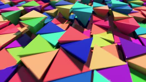 abstract motion animation of bright multi-colored three-dimensional triangles. seamless loop 3d render