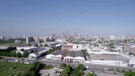 Aerial-forward-view-of-the-vibrant-life-and-diverse-architecture-of-Barranquilla,-encapsulating-the-city's-dynamic-essence