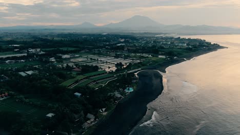 keramas beach and agung volcano in front aerial footage from bali indonesia