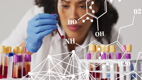 Animation-of-chemical-structures-over-biracial-female-doctor-with-test-tubes