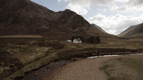 white lagangarbh hut in front of buachaille etive mor in glen coe, scotland