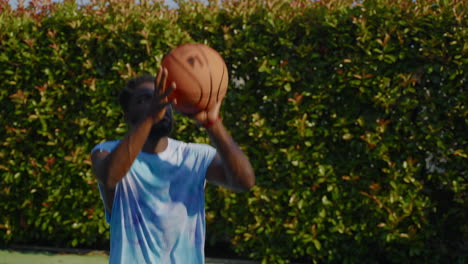 man playing basketball outdoors