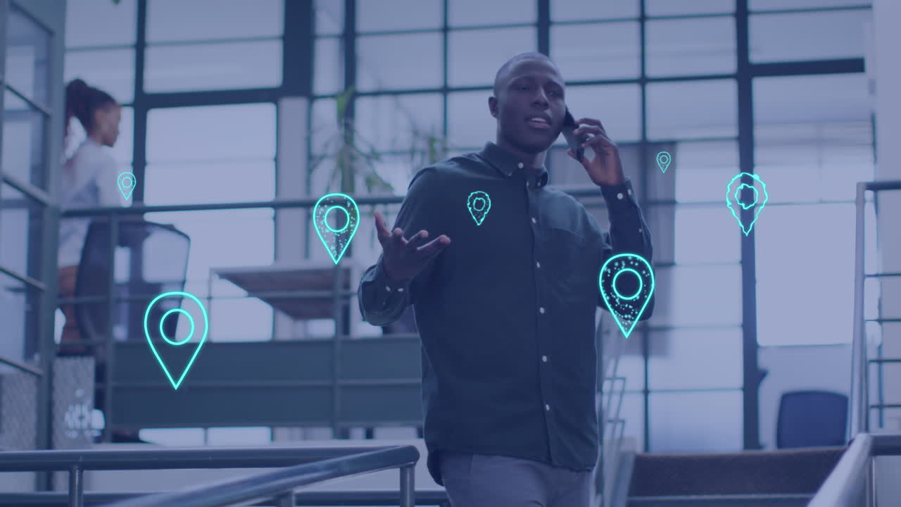 Animation of data with location icons over african american businessman in office