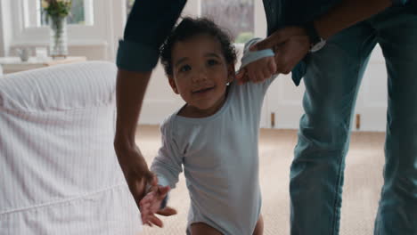 happy baby learning to walk toddler taking first steps with father helping infant teaching child at home 4k