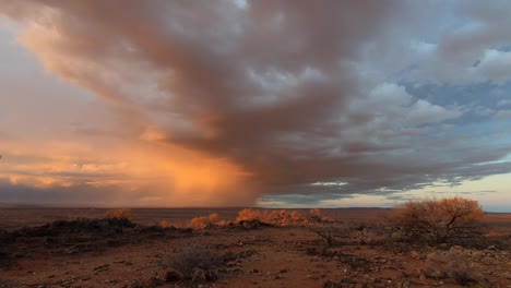 storm clouds over the harsh australian outback at sunset