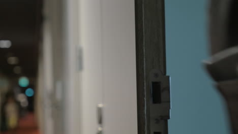 woman opening hotel door with a cardkey