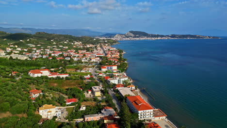 aerial drone view of a beach town in greece along the mediterranean sea