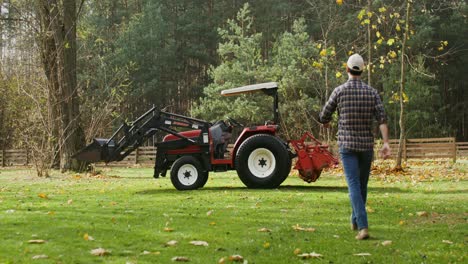 man working on a farm with a tractor