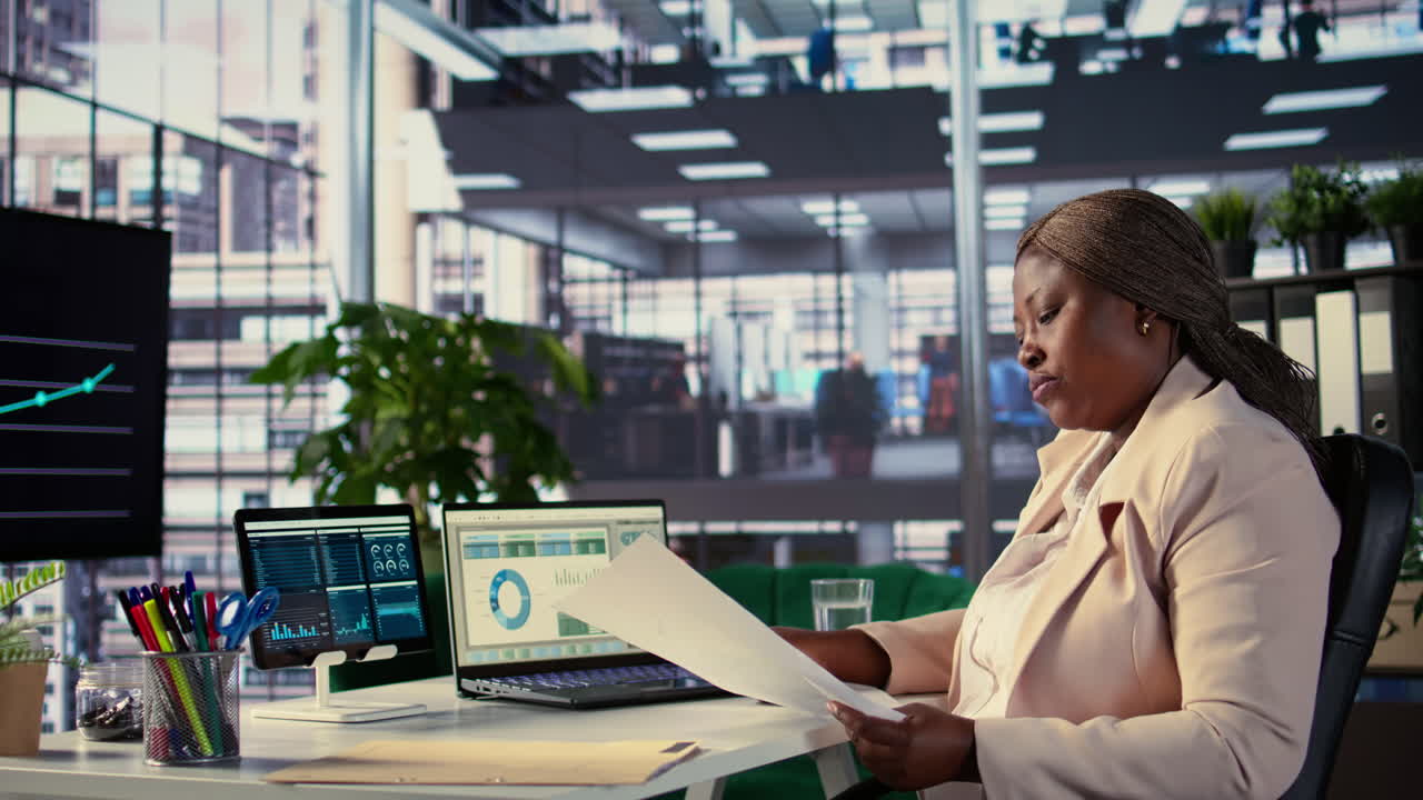 Business Woman Analyzing Data in Modern Office