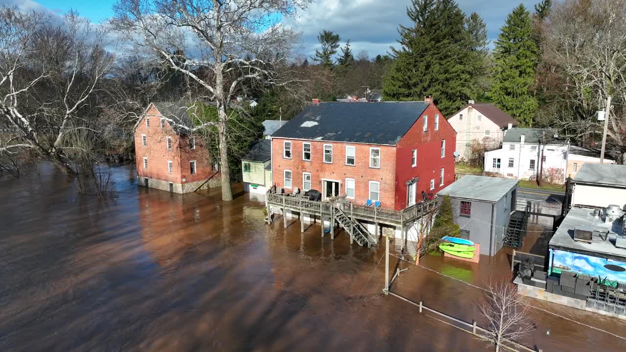 Aerial establishing shot of flooded homes