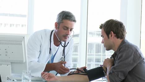 male doctor examining a patient