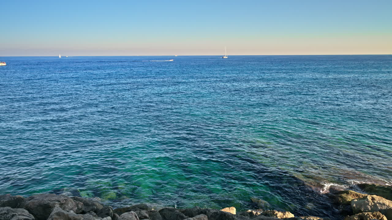 Distant view of boats moving on the sea in Menton, the French Riviera