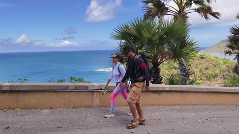 couple hiking with ocean view