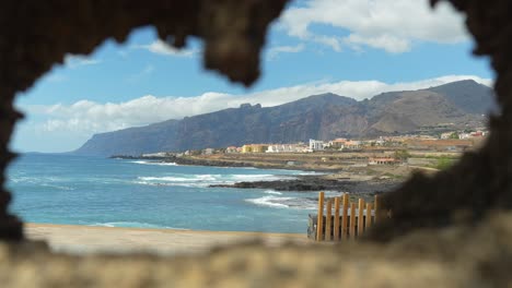 peeking-through-hole-Tenerife-Canary-Island,-POV-dynamic