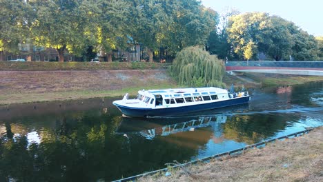 Boat-sails-through-the-canal-of-the-meuse-in-the-center-of-den-bosch-Netherlands