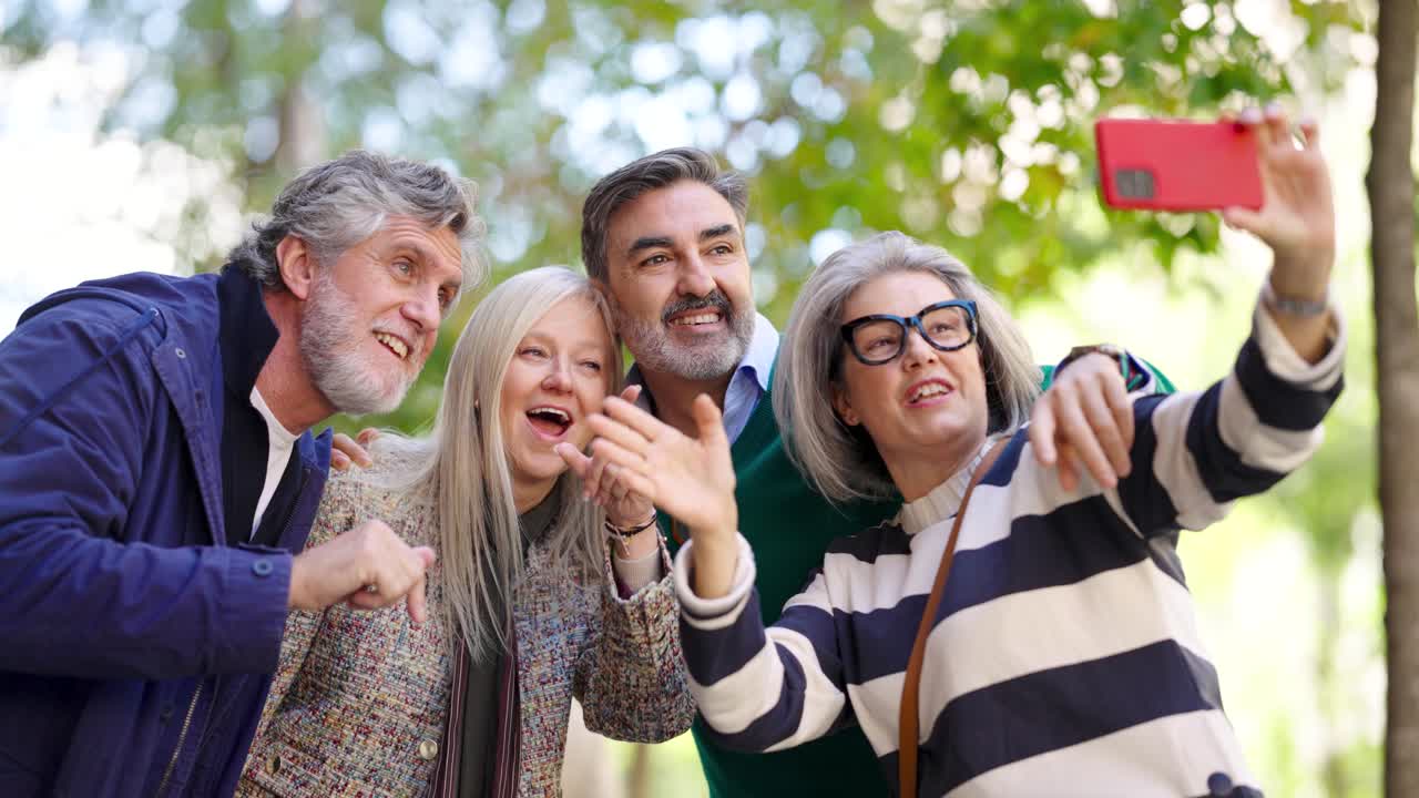 Group of Mature Adults Taking a Selfie Outdoors