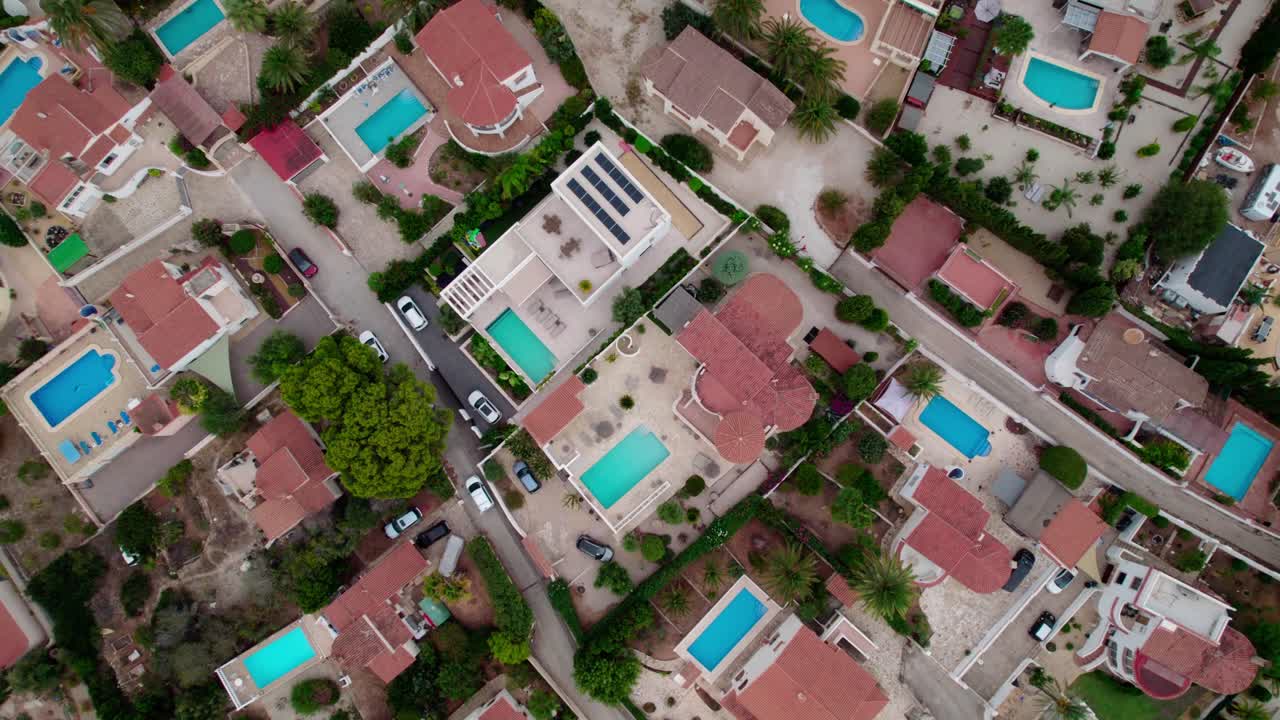 Above View Of Luxury Villas With Private Pools At Calpe Town Resort In Costa Blanca, Spain. Aerial Topdown Shot