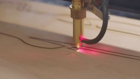 cnc laser cutting machine cuts wooden plank and plywood