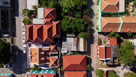 Drone-top-down-of-orange-colonial-roofs-of-Otrobanda-Willemstad-Curacao,-urban-texture