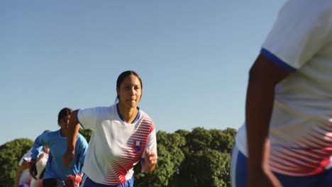 female soccer team running behind each other. 4k