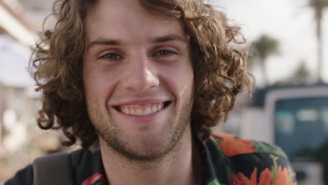 close up portrait of young attractive man smiling happy enjoying sunny vacation travel