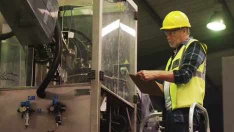 engineer writing on clipboard