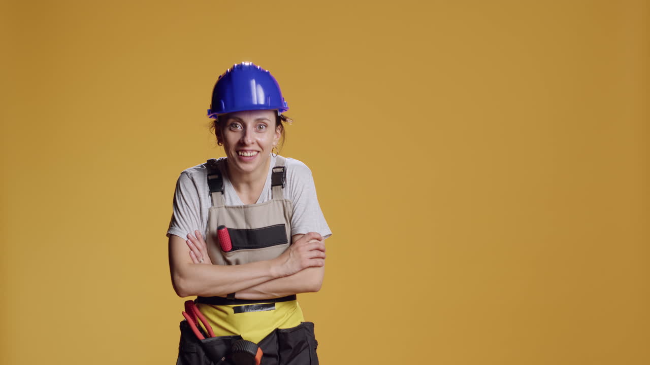 Portrait of empowered female constructor searching for something