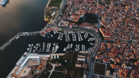 palermo harbor and old town, captured from above during warm sicilian evening. aerial drone top view