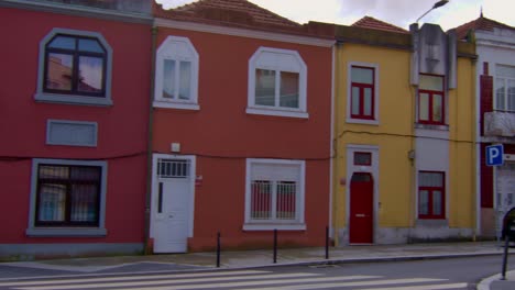 Panning-shot-of-some-houses-along-a-street-in-Porto