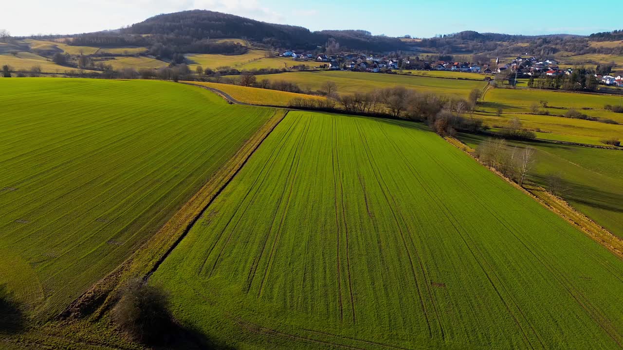 Expansive Aerial View Over Vibrant Green Agricultural Fields