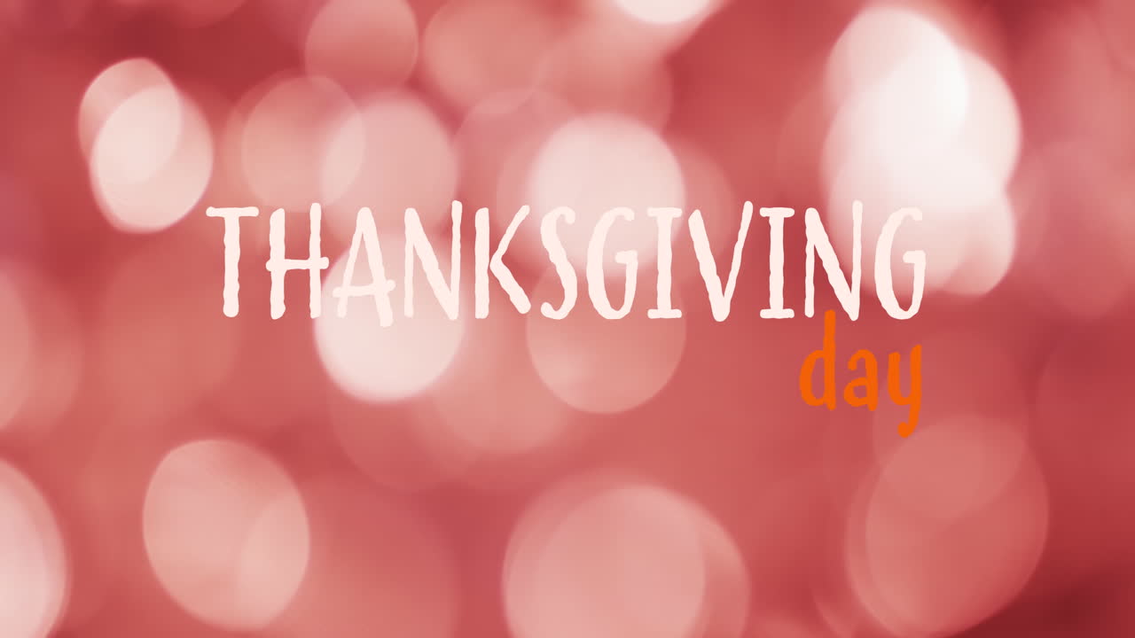Animazione del testo 'Thanksgiving Day' su luci tremolanti.