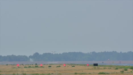 navigating the smoke: firefighting aircraft on landing path at kamloops airport