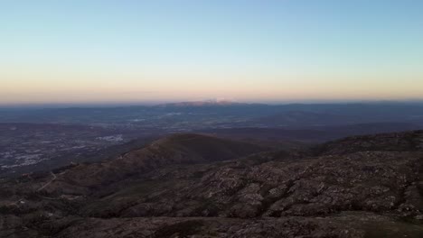 a vibrant sunset and a colorful horizon atop portugal's highest peak in the serra de estrella mountain range