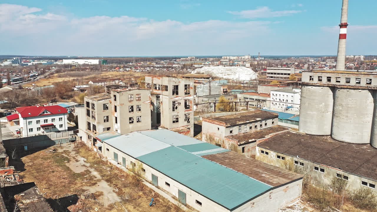 View of abandoned industrial place. Aerial view of abandoned industrial buildings through cityscape