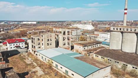 view of abandoned industrial place. aerial view of abandoned industrial buildings through cityscape