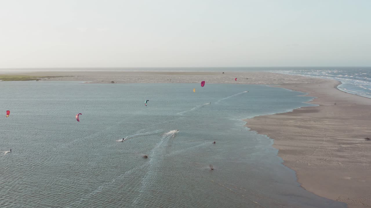 Aerial view of kitesurfing on the beach