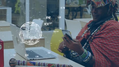 animation of globe with numbers over smiling african american businessman using laptop