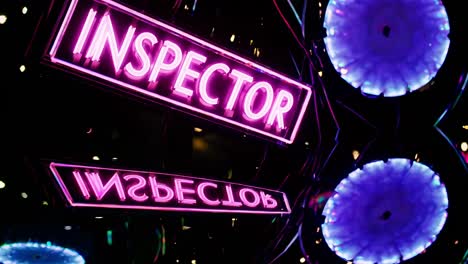 pink neon signs reading "inspector"