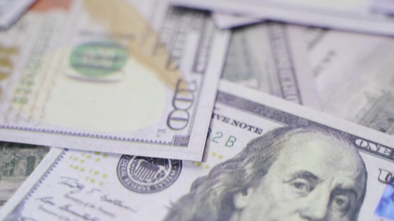 Dollar bills in slow motion. Finance and investment concept.