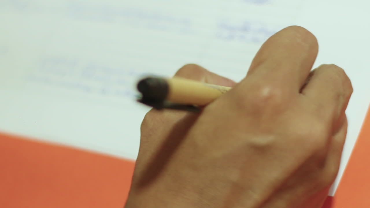 Latin woman signing on the registration list in a educational workshop event