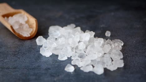 coarse sea salt on a wooden spoon