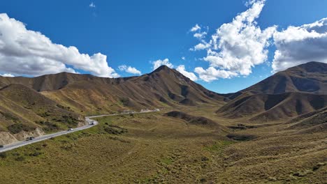 vehicles traveling on lindis pass in south island of new zealand