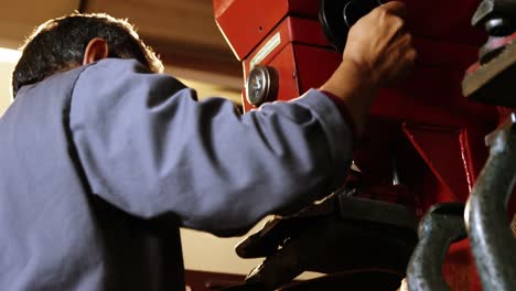 shoemaker making shoe on machine