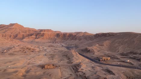 Fly-over-Luxor,-Valley-of-the-Kings-in-Egypt-in-a-Hot-Air-balloon-at-sunrise-overlooking-historical-sites