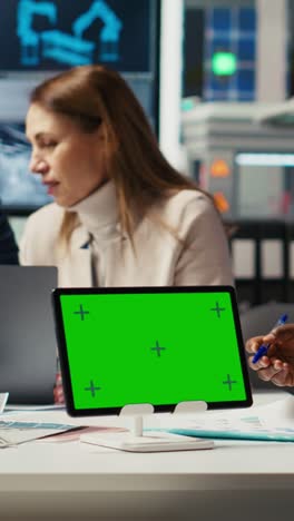 vertical video factory engineer tripping, refining production using green screen tablet