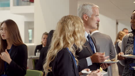 delegates networking during coffee break at conference