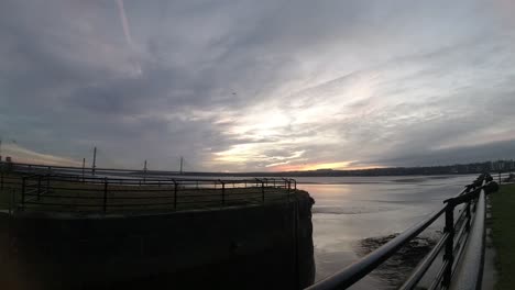 Timelapse-sunrise-waterfront-daybreak-over-river-Mersey-canal-channel