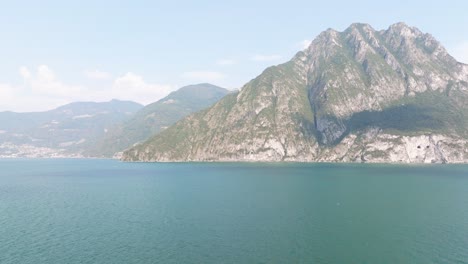 Amazing-aerial-view-of-mountains-and-lake-iseo-from-Riva-di-Solto,-Baia-dal-Bogn,Bergamo,Italy