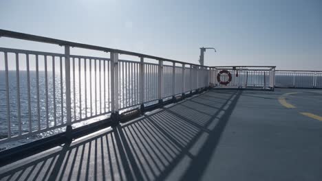 sun over ocean, the view from the deck of a large ship, ferry